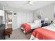A well-lit bedroom offers two twin beds, closet, and a glimpse of a tidy, organized home at 4306 Sunray Ct, Tampa, FL 33615