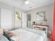 Bedroom with bright decor, ceiling fan, dual closets and a decorative side table at 4306 Sunray Ct, Tampa, FL 33615