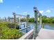 This boat lift offers waterfront living and easy access to water activities, surrounded by lush greenery at 4306 Sunray Ct, Tampa, FL 33615