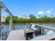 Enjoy relaxing on the private dock with comfortable seating and scenic water views at 4306 Sunray Ct, Tampa, FL 33615