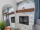 Stone fireplace with decorative mantle art and a modern design, reflected in a nearby mirror at 4306 Sunray Ct, Tampa, FL 33615