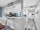 Bright open kitchen with an adjacent dining area, featuring white cabinets and stainless steel appliances at 4306 Sunray Ct, Tampa, FL 33615