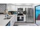 This fully-equipped kitchen features sleek stainless steel appliances and a modern backsplash at 4306 Sunray Ct, Tampa, FL 33615