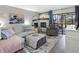 Cozy living room featuring a fireplace, comfortable seating, and access to an outdoor patio at 4306 Sunray Ct, Tampa, FL 33615