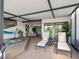 A spacious covered lanai featuring stylish furniture, potted plants, and a serene outdoor living area at 4306 Sunray Ct, Tampa, FL 33615