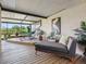 Relax in this covered lanai featuring stylish furniture, potted plants, and a serene outdoor space at 4306 Sunray Ct, Tampa, FL 33615