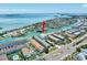 Aerial view of a waterfront condominium complex with boat access and stunning ocean views at 455 Pinellas Bayway S # 2B, Tierra Verde, FL 33715