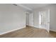 Bedroom features light-colored wood floors with access to bathroom at 455 Pinellas Bayway S # 2B, Tierra Verde, FL 33715