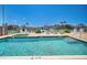 Resort-style pool overlooks the waterway with beautiful seating and landscaping at 455 Pinellas Bayway S # 2B, Tierra Verde, FL 33715