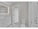 Modern bathroom featuring marble floors, a glass shower, and a backlit mirror over the vanity at 455 Pinellas Bayway S # 4A, Tierra Verde, FL 33715