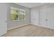 Minimalist bedroom with sleek floors, natural light, and convenient double closets for ample storage at 455 Pinellas Bayway S # 4A, Tierra Verde, FL 33715