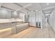 Modern kitchen featuring a large island, stainless steel appliances, and gray cabinetry at 455 Pinellas Bayway S # 4A, Tierra Verde, FL 33715