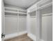 Spacious walk-in closet with custom shelving and hanging rods for optimal organization at 455 Pinellas Bayway S # 4A, Tierra Verde, FL 33715