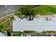 Top-down view of condo building showing roof, parking, landscaping, and patio at 5129 Se Salmon Se Dr # A, St Petersburg, FL 33705