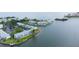 Waterfront condo community with docks, lush landscaping, and convenient parking at 5129 Se Salmon Se Dr # A, St Petersburg, FL 33705