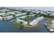 Waterfront condo community with boat docks, parking, and lush landscaping at 5129 Se Salmon Se Dr # A, St Petersburg, FL 33705