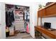 Organized closet with shelving, clothing racks, and an adjacent desk area for added convenience at 5129 Se Salmon Se Dr # A, St Petersburg, FL 33705