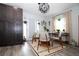Dining area featuring modern furniture, a large cabinet, and natural light at 5129 Se Salmon Se Dr # A, St Petersburg, FL 33705