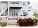 Charming outdoor space with multiple seating areas, white fencing, and beautiful landscaping at 5129 Se Salmon Se Dr # A, St Petersburg, FL 33705