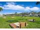 Horseshoe pits surrounded by green grass and palm trees at 5129 Se Salmon Se Dr # A, St Petersburg, FL 33705