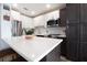 Bright kitchen with white cabinets, stainless steel appliances, and white countertops at 5129 Se Salmon Se Dr # A, St Petersburg, FL 33705