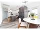 Bright kitchen with stainless appliances, an island, and an adjacent dining area at 5129 Se Salmon Se Dr # A, St Petersburg, FL 33705