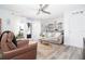 Bright living room featuring modern decor, access to the patio, and stylish furniture at 5129 Se Salmon Se Dr # A, St Petersburg, FL 33705