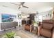Open concept living space with a kitchen, dining area, modern decor, and stylish furniture at 5129 Se Salmon Se Dr # A, St Petersburg, FL 33705
