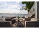 Relaxing outdoor patio area overlooking the water, furnished with comfortable seating and a table at 5129 Se Salmon Se Dr # A, St Petersburg, FL 33705