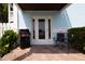 Outdoor patio featuring furniture, a grill, yellow flowers and water view at 5129 Se Salmon Se Dr # A, St Petersburg, FL 33705