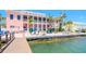 A gorgeous waterfront patio and deck area is furnished with patio furniture and lounge chairs at 5129 Se Salmon Se Dr # A, St Petersburg, FL 33705