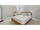 Bright bedroom with a view into the ensuite bathroom and a side window at 5501 N 15Th St, Tampa, FL 33610
