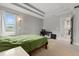 Bedroom with a tray ceiling, neutral walls, and a large window with blinds at 5501 N 15Th St, Tampa, FL 33610
