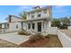 Charming two-story home boasting a covered porch, stone accents, and a well-manicured front yard at 5501 N 15Th St, Tampa, FL 33610