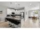 Modern kitchen with stainless steel appliances, granite countertops, and a breakfast bar with seating at 5501 N 15Th St, Tampa, FL 33610