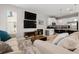 Cozy living room with plush sofas, modern media center, and an inviting open layout to the kitchen at 5501 N 15Th St, Tampa, FL 33610