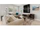 Inviting living room featuring comfortable seating, a media center, and bright windows at 5501 N 15Th St, Tampa, FL 33610