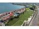 Aerial shot of residences close to a golf course, waterfront and Tampa Bay at 5559 Escondida S Blvd, St Petersburg, FL 33715