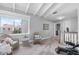 Relaxing bonus room with wicker chairs, exercise equipment, and a large window view at 5559 Escondida S Blvd, St Petersburg, FL 33715