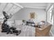 Spacious bonus room with sloped ceiling, exercise equipment, and seating area at 5559 Escondida S Blvd, St Petersburg, FL 33715