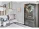 Inviting foyer featuring a decorative wreath, neutral tones, and stylish accents at 5559 Escondida S Blvd, St Petersburg, FL 33715