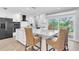 Gourmet kitchen features a large center island, stainless appliances, breakfast bar, and sliding glass doors to the backyard at 5559 Escondida S Blvd, St Petersburg, FL 33715