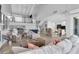Open concept living space with an upstairs loft and views into kitchen at 5559 Escondida S Blvd, St Petersburg, FL 33715