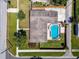 Aerial view of home showcasing pool, landscaping, and overall property layout at 5601 16Th N St, St Petersburg, FL 33703
