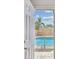 View of the backyard pool through a doorway at 5601 16Th N St, St Petersburg, FL 33703