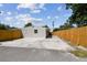 New wood fence along side of the home with concrete parking pad at 5601 16Th N St, St Petersburg, FL 33703
