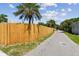 New wood fence along backyard property line provides privacy and security at 5601 16Th N St, St Petersburg, FL 33703