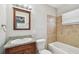 This bathroom has a granite vanity and tiled shower and tub enclosure at 5601 16Th N St, St Petersburg, FL 33703