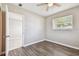Bedroom featuring hardwood floors, a window and view into another room at 5601 16Th N St, St Petersburg, FL 33703