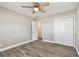 This bedroom features a large closet, light woodgrain-look floors and great natural light at 5601 16Th N St, St Petersburg, FL 33703